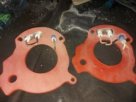Two burner gaskets laid out during a service