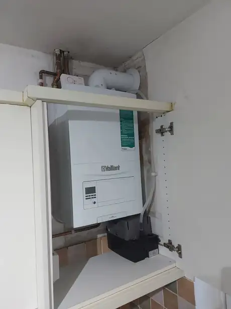 A Vaillant boiler fitted inside a cupboard