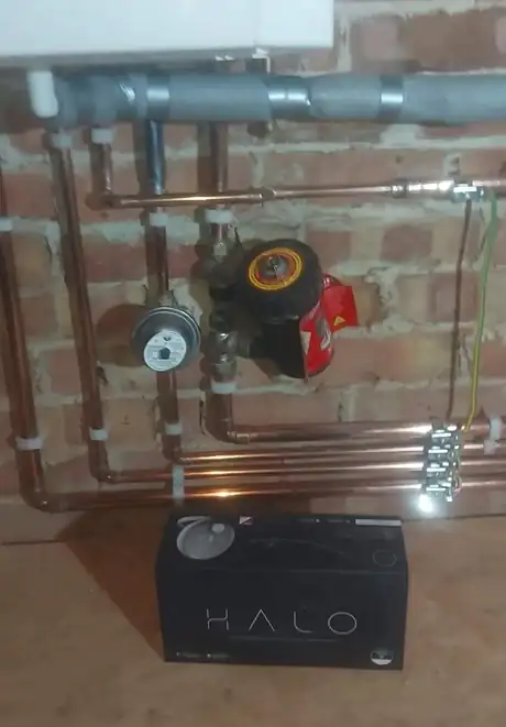 Copper pipework on brick with a new system filter below