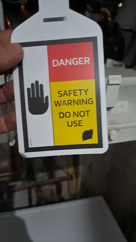 A Danger Do Not Use safety warning label attached to an appliance