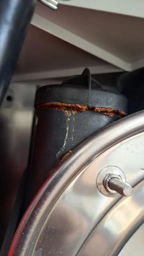 A rust trail running down the side of a hot water cylinder
