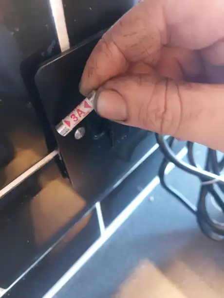 A three amp fuse held at the fused spur