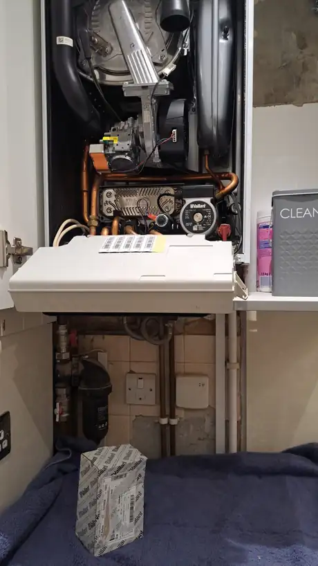 A boiler opened with the control panel dropped down
