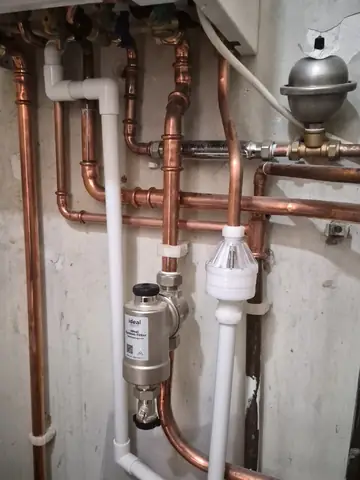 Copper pipework, a magnetic filter and an air separator fitted below a boiler